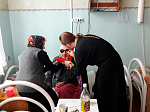 Причастие в Павловском доме-интернате для престарелых и инвалидов